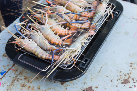 prawns are grilled on the electric indoor  Barbecue grill Griddleの写真素材