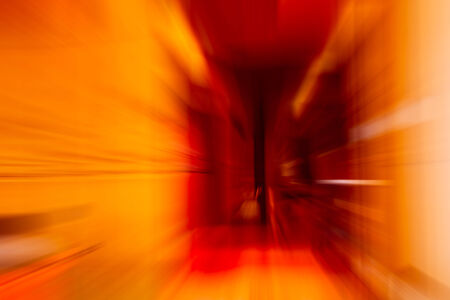 red and orange color tone radial motion blur illustration abstract for backgroundの写真素材