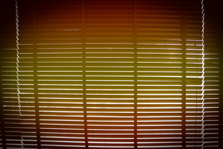 orange and yellow gradient with vignette on horizontal sun blind or sunshade for backgroundの写真素材