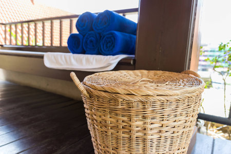 stack of folded blue towel and rattan basket for spa massageの写真素材