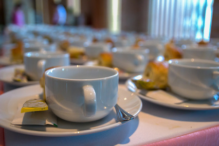 many empty cup on saucer with spoon, non-dairy creamer and sugar for coffee breakの写真素材