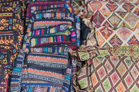 Several handmade fabric handbag with different colorful designsの写真素材