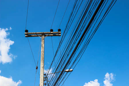 electric pole and wire with blue sky backgroundの写真素材