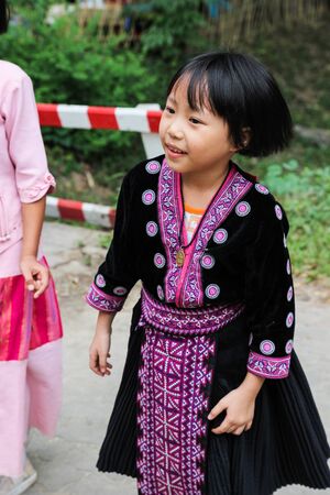 Chiangmai, Thailand - December 18, 2014: thailand hill tribe girl with traditional northern tribe costume in royal project fair at Chiangmai university.のeditorial素材
