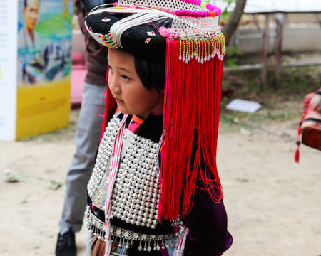 Chiangmai, Thailand - December 18, 2014: thailand hill tribe girl with traditional northern tribe costume in royal project fair at Chiangmai university.のeditorial素材