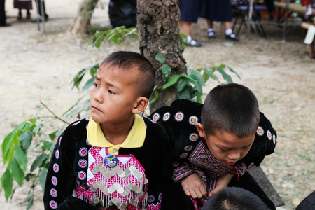 Chiangmai, Thailand - December 18, 2014: thailand hill tribe boy with traditional northern tribe costume in royal project fair at Chiangmai university.のeditorial素材