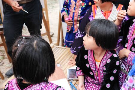 Chiangmai, Thailand - December 18, 2014: thailand hill tribe girl with traditional northern tribe costume in royal project fair at Chiangmai university.のeditorial素材