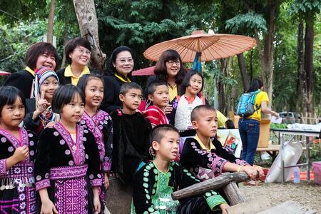 Chiangmai, Thailand - December 18, 2014: thailand hill tribe boy and girl with traditional northern tribe costume in royal project fair at Chiangmai university.のeditorial素材