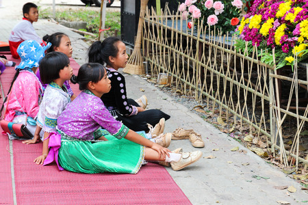 Chiangmai, Thailand - December 18, 2014: thailand hill tribe girl with traditional northern tribe costume in royal project fair at Chiangmai university.のeditorial素材