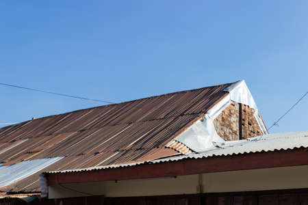 old galvanized iron brown roof in asian cityの写真素材