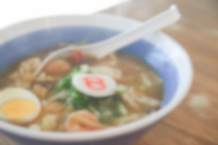blurry defocused image of japanese noodle with pork and egg for backgroundの写真素材