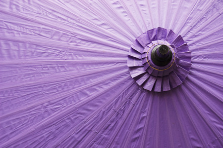 the surface of thailand traditional style purple umbrella for backgroundの写真素材