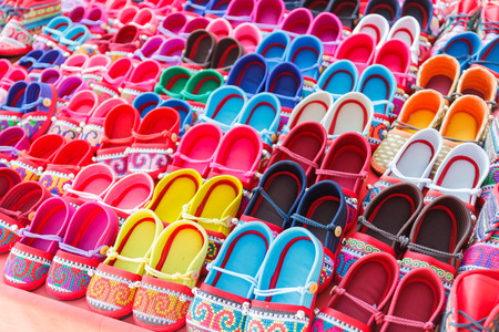 colorful handmade fabric kid shoe of tribesman in northern part of thailandの写真素材