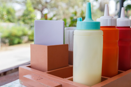 bottle of tomato ketchup, chili sauce and mayonnaiseの写真素材