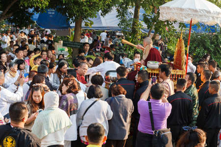 Chiangmai, Thailand - February 22, 2015: buddhism monk is blessing people after he spend 3 days in continuous meditation in Sridonmoon templeのeditorial素材