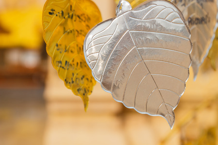 silver metal sheet in bo leaf shape decorating in asian templeの写真素材