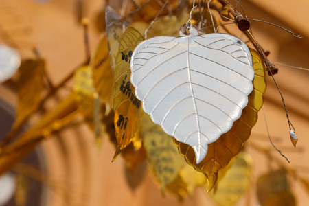 silver metal sheet in bo leaf shape decorating in asian templeの写真素材