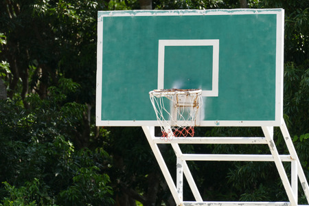 Basketball hoop in outdoor court in the parkの写真素材