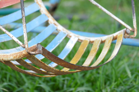 old metal grunge swing in the parkの写真素材