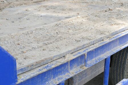 dirt on the old blue truck dumper for constructionの写真素材
