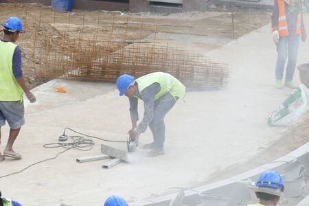 Chiang Mai, Thailand - July 25, 2015: The workers are constructing pathway at the construction site in Nirotharam temple.のeditorial素材