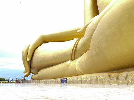 Ang Thong, Thailand - August 1, 2015: buddhist people touch the finger of big golden buddha statue in Muang temple.のeditorial素材