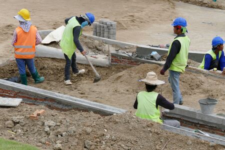 Chiang Mai, Thailand - July 25, 2015: The workers are constructing pathway at the construction site in Nirotharam temple.のeditorial素材