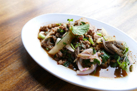 spicy minced pork salad with shallot, mint leavesの写真素材