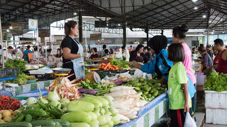 Nakhon Si Thammarat, Thailand - July 31, 2015: People buy and sell food in the local market in Sichon district.のeditorial素材