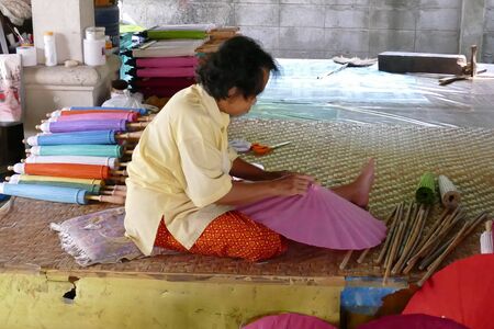 Chiang Mai, Thailand, September 30, 2015: The artisan is making thailand traditional paper umbrellaのeditorial素材