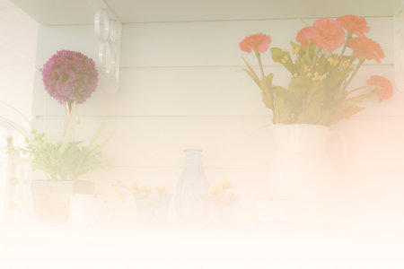 blue bottle, flower in vase decorating on shelf on the wall (color filter and soft focus)