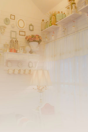 vintage style room with drape curtain, lamp, chair, bottle on shelf, ceramic doll, picture frame on the wall (color filter and soft focus)の写真素材