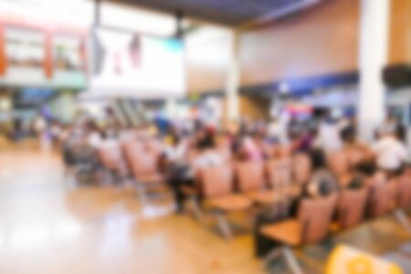 blurry defocused image of people at the airport terminal buildingの写真素材