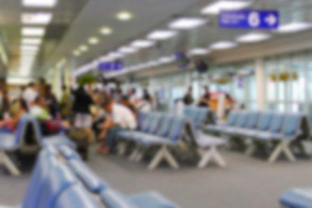 blurry defocused image of people at the gate inside the airport buildingの写真素材