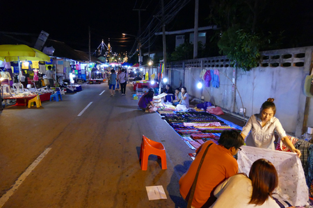 Mae Hong Son, Thailand - November 21, 2015: People walking and buying things at walking street night market in Mae Hong Son, Thailand on November 21, 2015.のeditorial素材