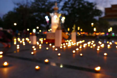 blurry defocused image of candle light at nightの写真素材
