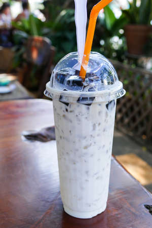 chinese vegetable black jelly with milk and ice in a cupの写真素材