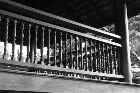 old wooden bannister of the balcony terrace, black and white