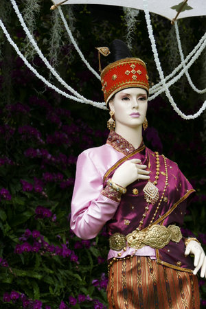 dummy with traditional antique dress costume of Thailand