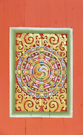 the sculpture art in Bhutan style on the wallの写真素材