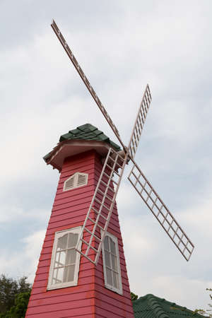 red wooden windmill building in retro styleの写真素材
