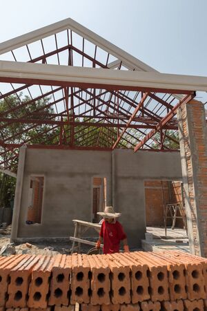 Chiang Mai, Thailand - March 9, 2016: worker build house at construction site at Hangdong district in Chiang Mai, Thailand on March 9, 2016.のeditorial素材
