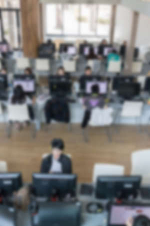 student use computer to access to internet for education in university (blurry defocused image)の写真素材