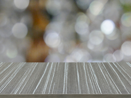 empty wooden table with white bokeh blur background for displaying your productの写真素材