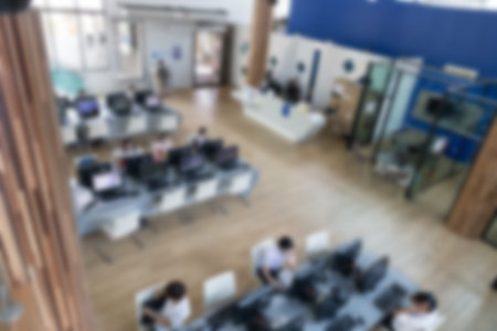 student use computer to access to internet for education in university (blurry defocused image)