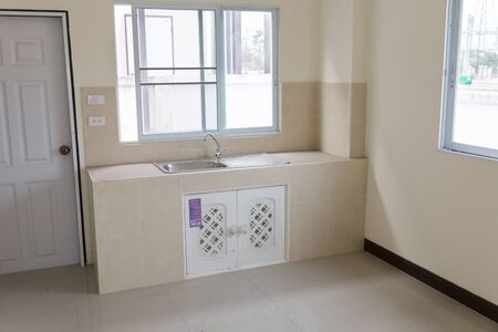 faucet and sink on counter and cabinet in modern kitchenのeditorial素材
