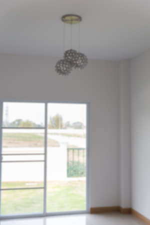 metal sphere lamp hanging on the ceiling with door background (blurry defocused for interior background)のeditorial素材