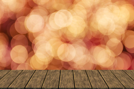 defocused blurry christmas bokeh light (blur background with wood table top for display or montage...