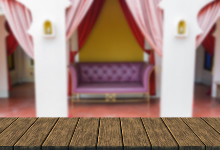 purple leather sofa in the living room (blur background with wood table top for display or montage your product)の写真素材