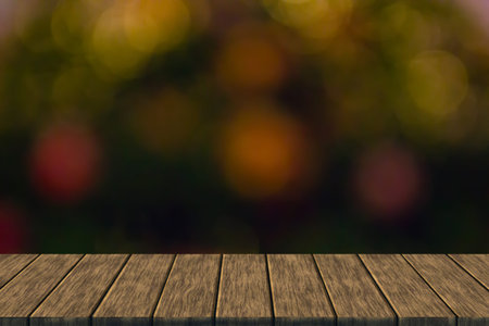 defocused blurry christmas bokeh light (blur background with wood table top for display or montage...